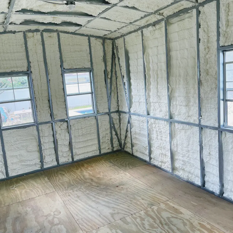 Closed-cell spray foam insulation applied to wall cavities in a residential project in Merrill